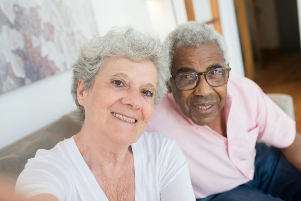 Man and woman sitting together on their couch